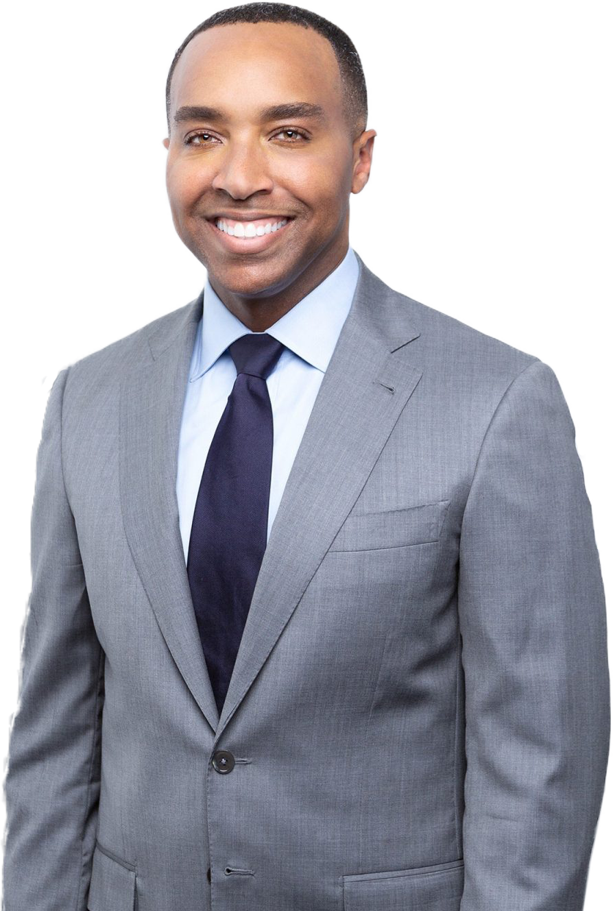 Smiling man in gray suit with clear skin, professional portrait for Birmingham dermatology, injectables and skincare clinic