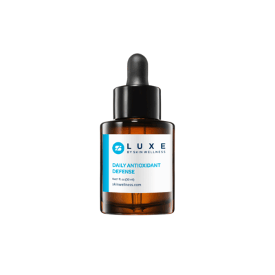 Luxe Daily Antioxidant Defense serum bottle with dropper — amber glass skincare for daily antioxidant protection