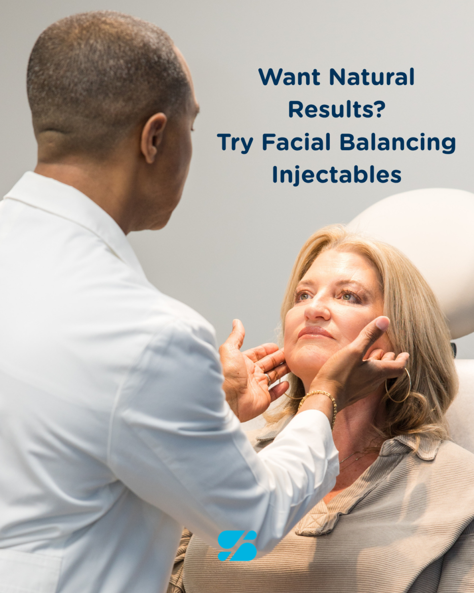 Doctor examining a woman's face for facial balancing injectables at a Birmingham dermatology clinic